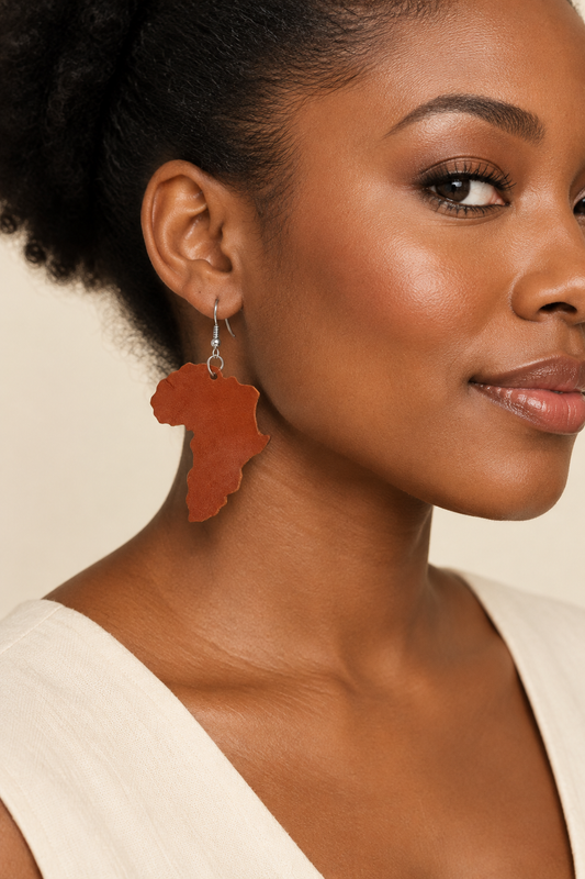Model wearing chestnut Africa-shaped leather earrings